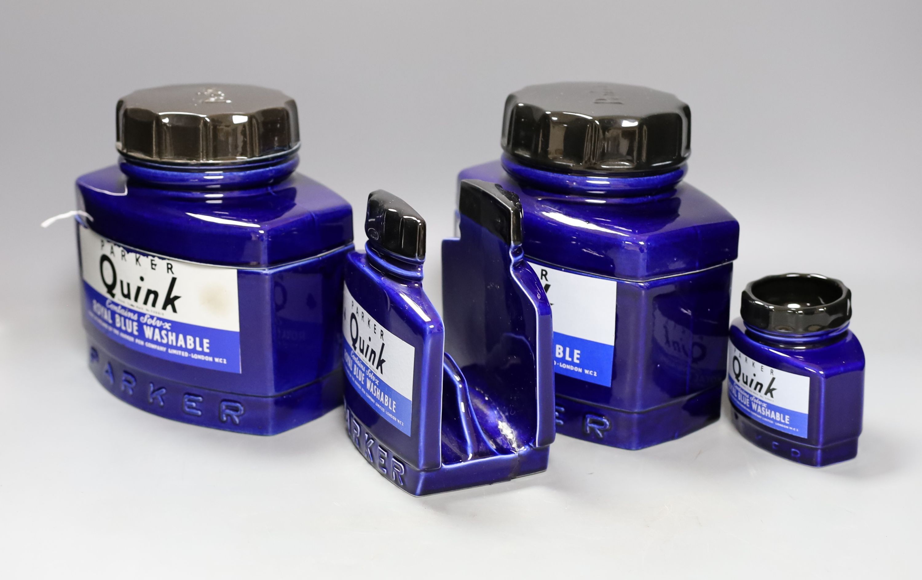 Four large display ceramic Royal Blue Parker Quink ink bottles, largest 20 cms high.